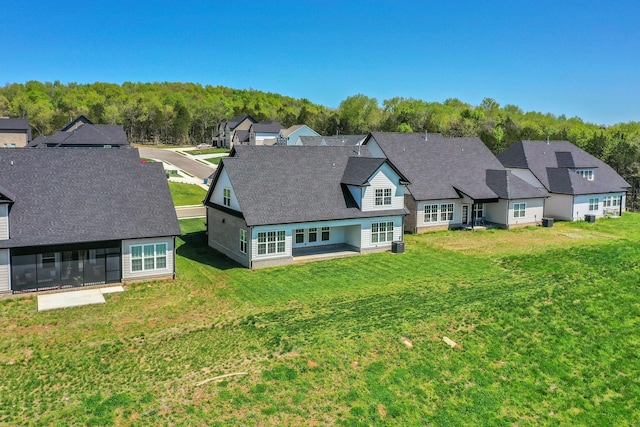 drone / aerial view with a view of trees