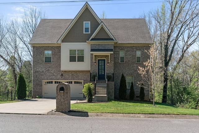 view of front of house featuring a front yard, brick siding, driveway, and an attached garage