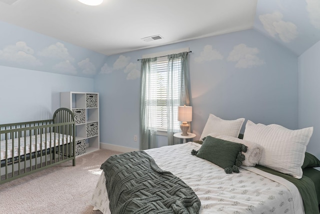 carpeted bedroom featuring visible vents, baseboards, and lofted ceiling