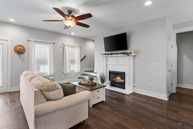 living area featuring stairs, dark wood-style floors, and recessed lighting