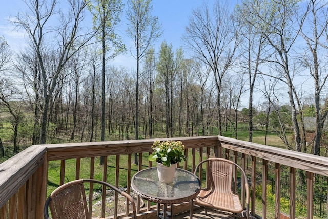 wooden terrace featuring outdoor dining space