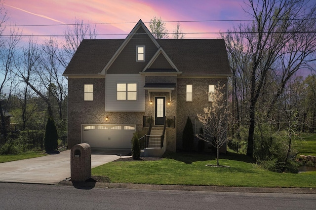 view of front facade featuring an attached garage, driveway, brick siding, and a lawn