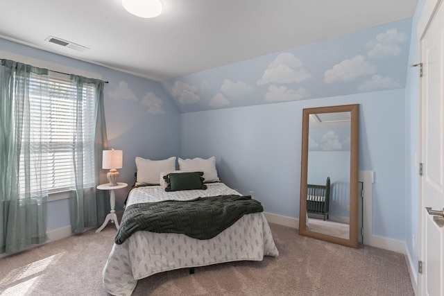 carpeted bedroom with visible vents, baseboards, and lofted ceiling