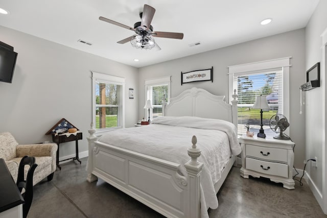 208 Lakeview Dr, Hohenwald, TN 38462 - bedroom with concrete flooring, multiple windows, baseboards, recessed lighting, and a ceiling fan