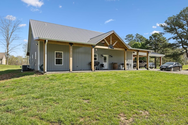 208 Lakeview Dr, Hohenwald, TN 38462 - view of front facade with cooling unit, a front lawn, and metal roof