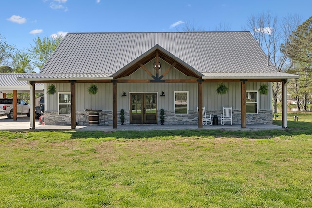 208 Lakeview Dr, Hohenwald, TN 38462 - back of house with a lawn, board and batten siding, and a patio area