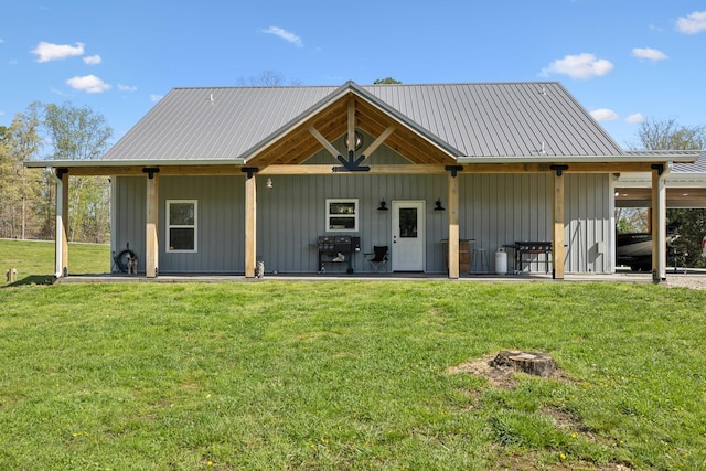 208 Lakeview Dr, Hohenwald, TN 38462 - back of property featuring a yard and metal roof