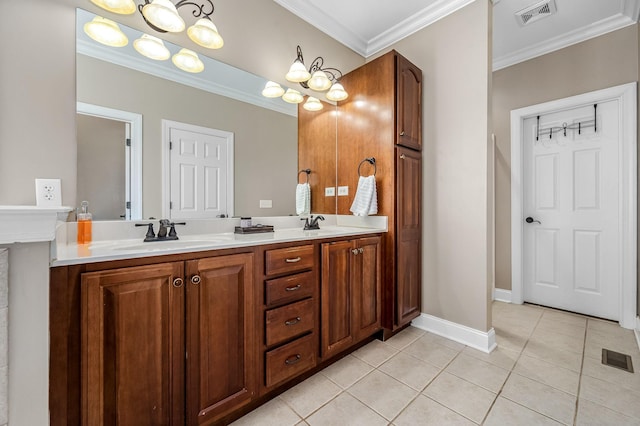 bathroom featuring tile patterned floors, a sink, ornamental molding, and visible vents