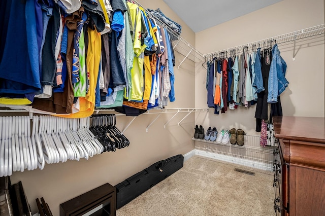 walk in closet with visible vents and carpet flooring