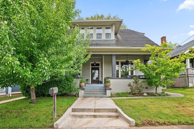 view of front of property with a front lawn and covered porch