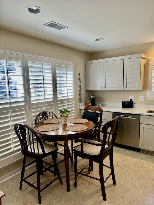 dining space with visible vents, recessed lighting, and light floors