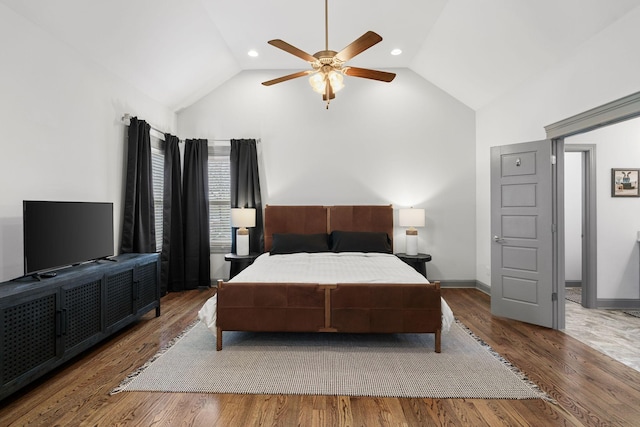 bedroom with wood finished floors, high vaulted ceiling, ceiling fan, and baseboards