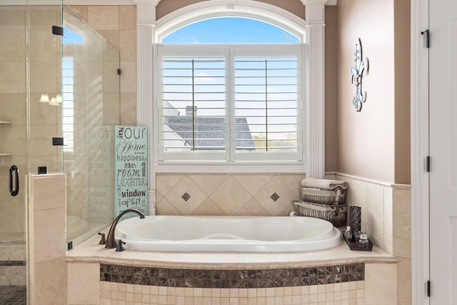763 Plantation Way, Gallatin, TN 37066 - full bath featuring a bath, a stall shower, and decorative columns