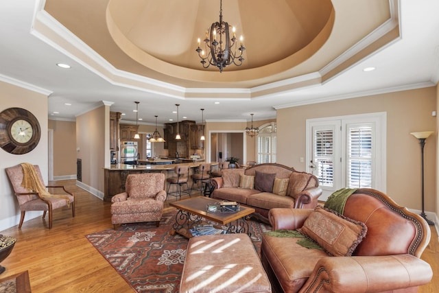 763 Plantation Way, Gallatin, TN 37066 - living area with plenty of natural light, light wood finished floors, a tray ceiling, and an inviting chandelier