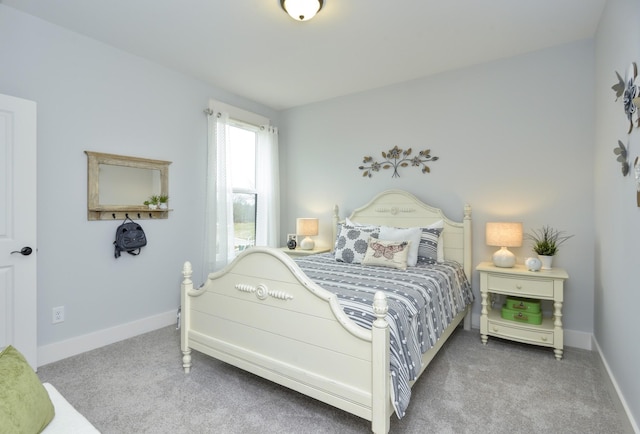 carpeted bedroom featuring baseboards