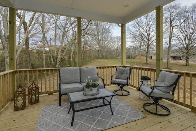wooden deck with an outdoor living space