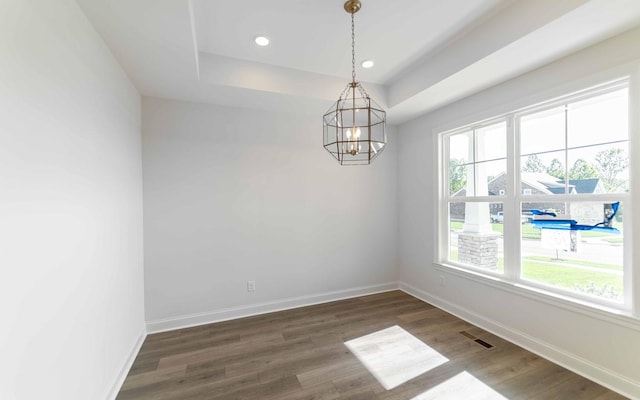 7705 Pine St, Fairview, TN 37062 - empty room featuring a chandelier, wood finished floors, baseboards, recessed lighting, and a tray ceiling