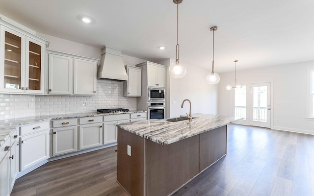 7705 Pine St, Fairview, TN 37062 - kitchen with custom range hood, stainless steel appliances, a sink, dark wood-style flooring, and decorative backsplash