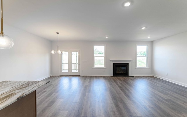 7705 Pine St, Fairview, TN 37062 - unfurnished living room with healthy amount of natural light, dark wood-type flooring, baseboards, and recessed lighting
