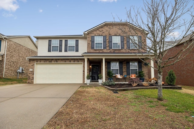 1006 Harmony Ln, Hendersonville, TN 37075 - traditional-style house featuring a front yard, an attached garage, covered porch, brick siding, and driveway