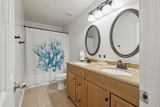 1006 Harmony Ln, Hendersonville, TN 37075 - full bath featuring a sink, visible vents, toilet, and double vanity