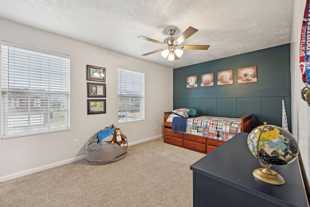 1006 Harmony Ln, Hendersonville, TN 37075 - carpeted bedroom with a textured ceiling, baseboards, and a ceiling fan