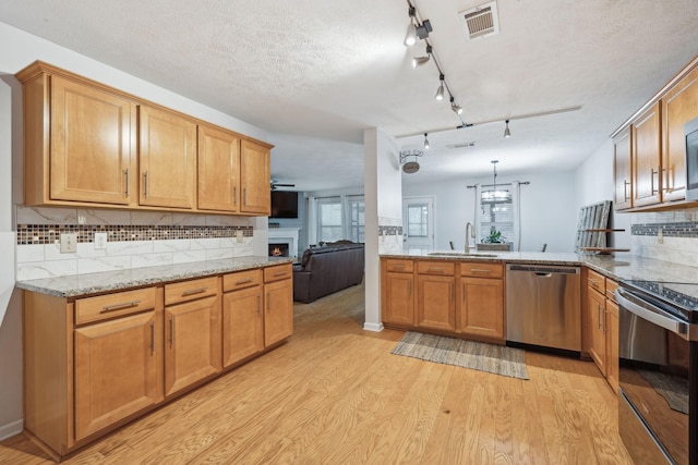 1006 Harmony Ln, Hendersonville, TN 37075 - kitchen with light wood-style flooring, visible vents, range with electric cooktop, a sink, and stainless steel dishwasher