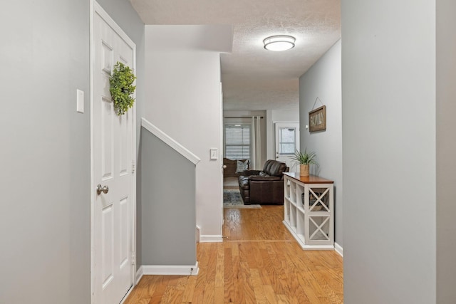 1006 Harmony Ln, Hendersonville, TN 37075 - hall with light wood finished floors, a textured ceiling, and baseboards