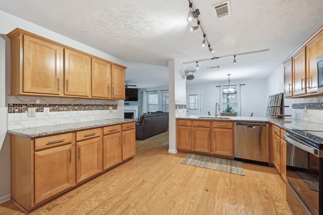 1006 Harmony Ln, Hendersonville, TN 37075 - kitchen with stainless steel dishwasher, visible vents, a sink, electric stove, and light wood finished floors