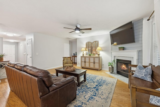 1006 Harmony Ln, Hendersonville, TN 37075 - living room with light wood-style flooring, a fireplace with flush hearth, baseboards, and a ceiling fan