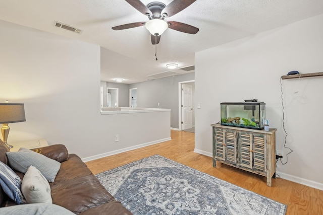 1006 Harmony Ln, Hendersonville, TN 37075 - living area with wood finished floors, attic access, a ceiling fan, and visible vents
