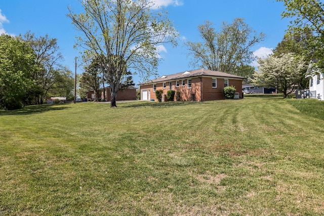 view of yard featuring an attached garage
