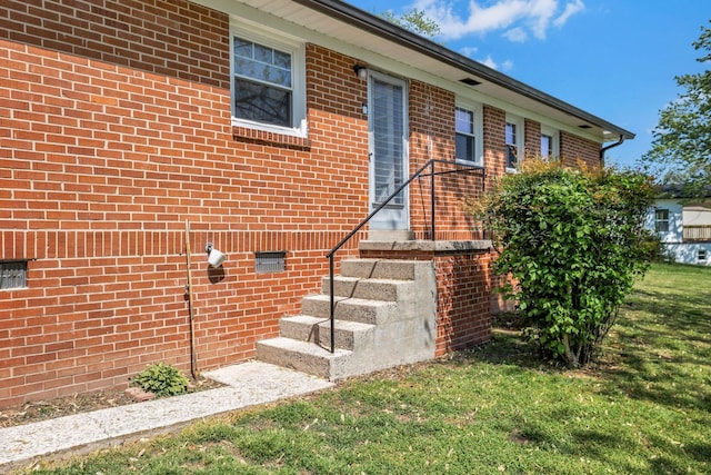 doorway to property with brick siding and crawl space