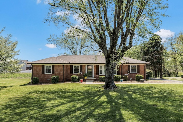 ranch-style home with brick siding and a front lawn