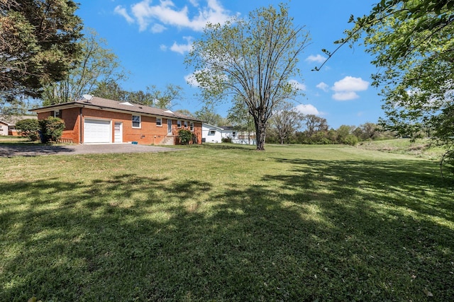 view of yard featuring a garage