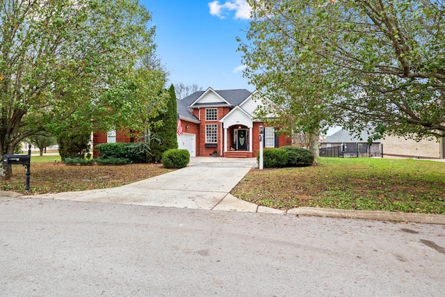 traditional-style house with an attached garage, driveway, and brick siding