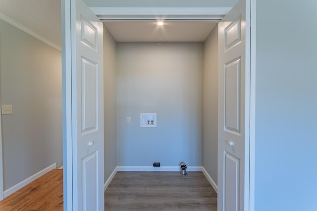 laundry room with laundry area, washer hookup, baseboards, and light wood-type flooring