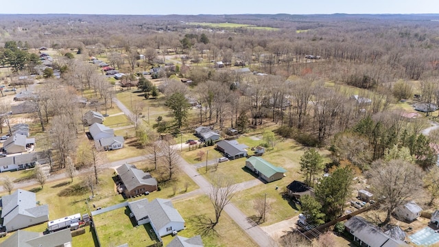 birds eye view of property with a forest view and a residential view