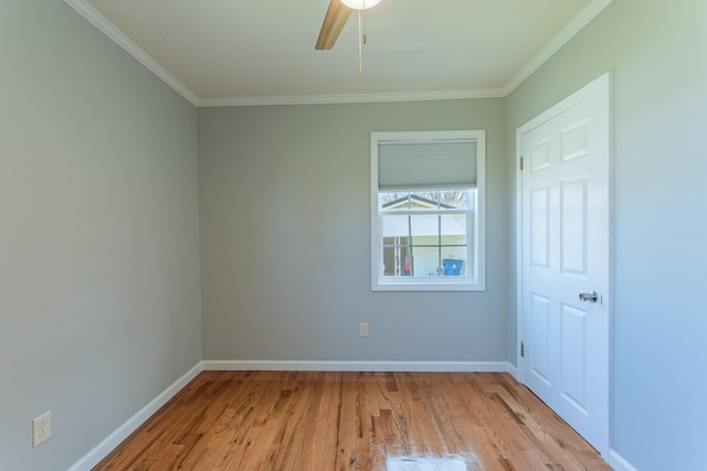 unfurnished bedroom with ornamental molding, light wood-style flooring, ceiling fan, and baseboards