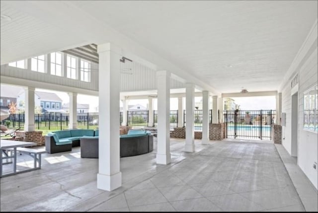 exterior space with outdoor lounge area and fence