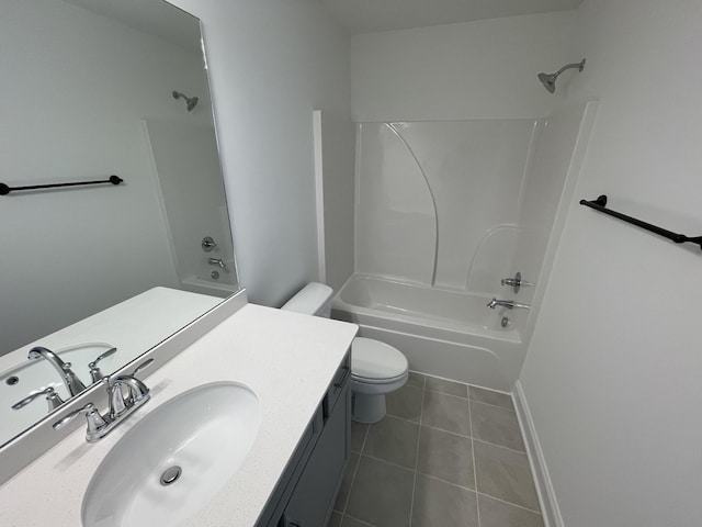 bathroom featuring toilet, bathing tub / shower combination, vanity, and tile patterned flooring