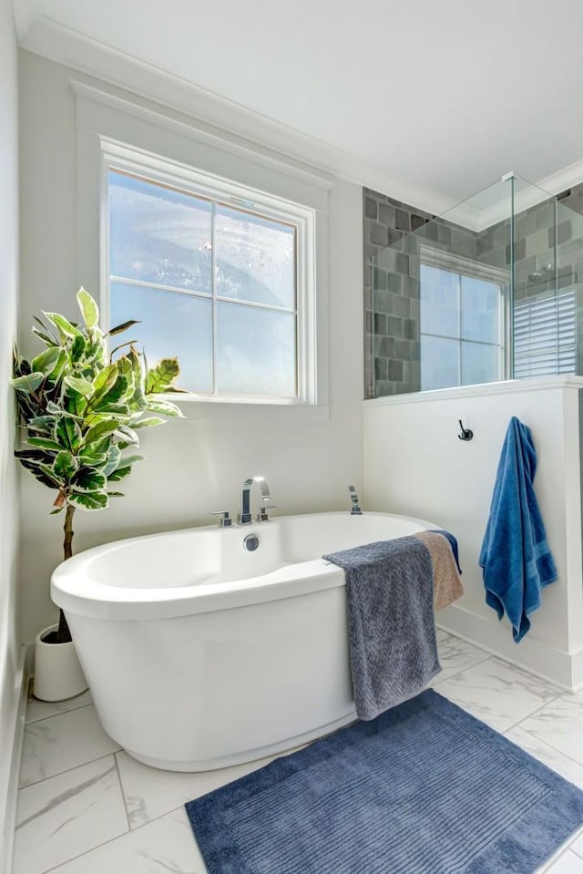 57 Watson Ct, Leoma, TN 38468 - full bathroom featuring marble look tile flooring, plenty of natural light, and a freestanding bath