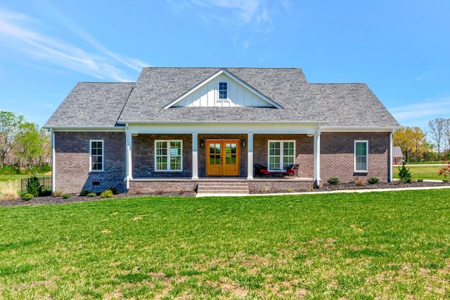 57 Watson Ct, Leoma, TN 38468 - view of front of house with brick siding, a front yard, french doors, a porch, and board and batten siding