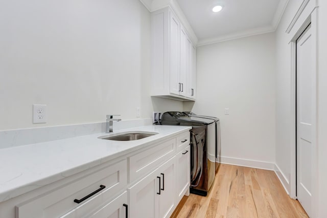 57 Watson Ct, Leoma, TN 38468 - laundry room with cabinet space, washer and dryer, ornamental molding, light wood-style floors, and recessed lighting