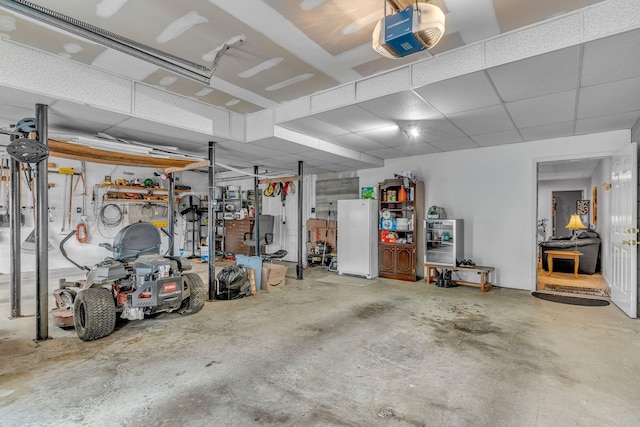 211 Northview Ct, Hendersonville, TN 37075 - garage with a garage door opener and freestanding refrigerator