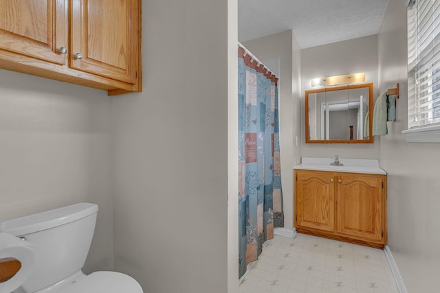 211 Northview Ct, Hendersonville, TN 37075 - bathroom with toilet, baseboards, tile patterned floors, vanity, and curtained shower
