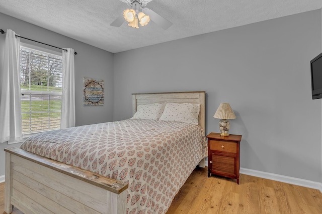 211 Northview Ct, Hendersonville, TN 37075 - bedroom featuring baseboards, wood finished floors, a textured ceiling, and a ceiling fan