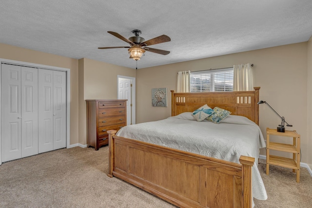211 Northview Ct, Hendersonville, TN 37075 - bedroom with light colored carpet, baseboards, a closet, a textured ceiling, and ceiling fan
