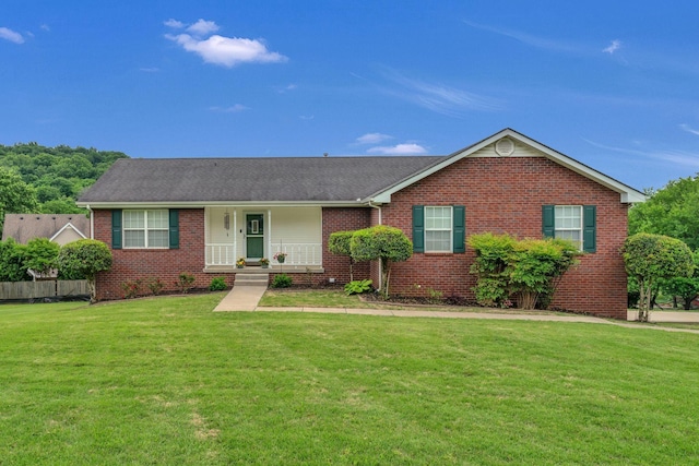 211 Northview Ct, Hendersonville, TN 37075 - ranch-style home featuring brick siding, a front lawn, a porch, and a shingled roof