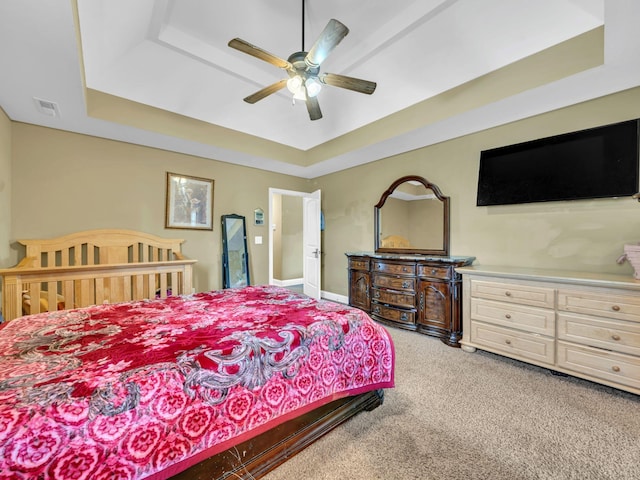 1084 Harrison Way, Clarksville, TN 37042 - bedroom with light colored carpet, a ceiling fan, visible vents, and a raised ceiling